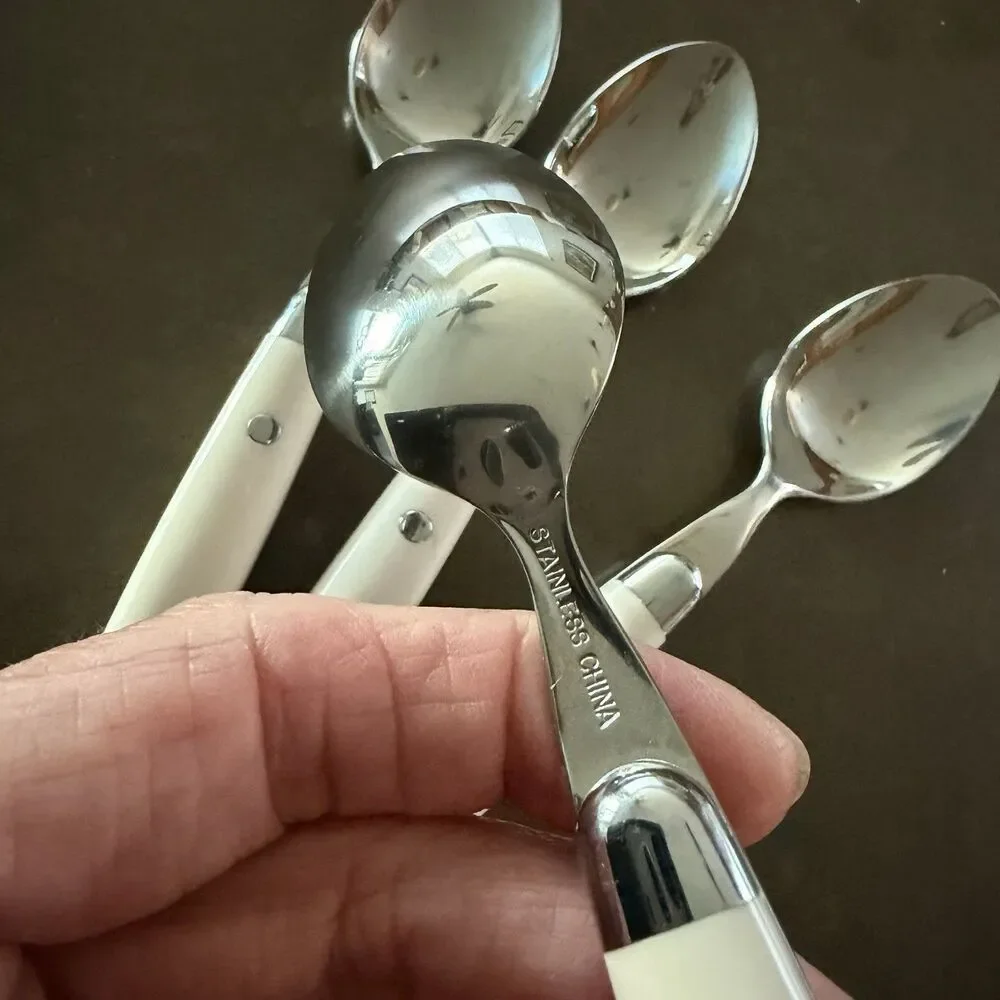 Four (4) teaspoons - Stainless Steel Plastic Ivory/White Similar to JUBILEE